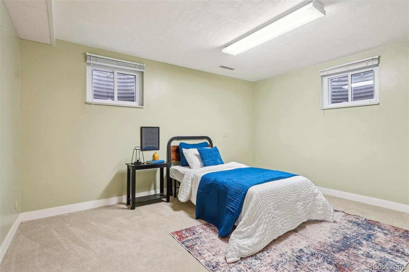 1118 Eagle Road Broomfield, CO 80020 - Photo 37 of 50 a bedroom with a bed and a window