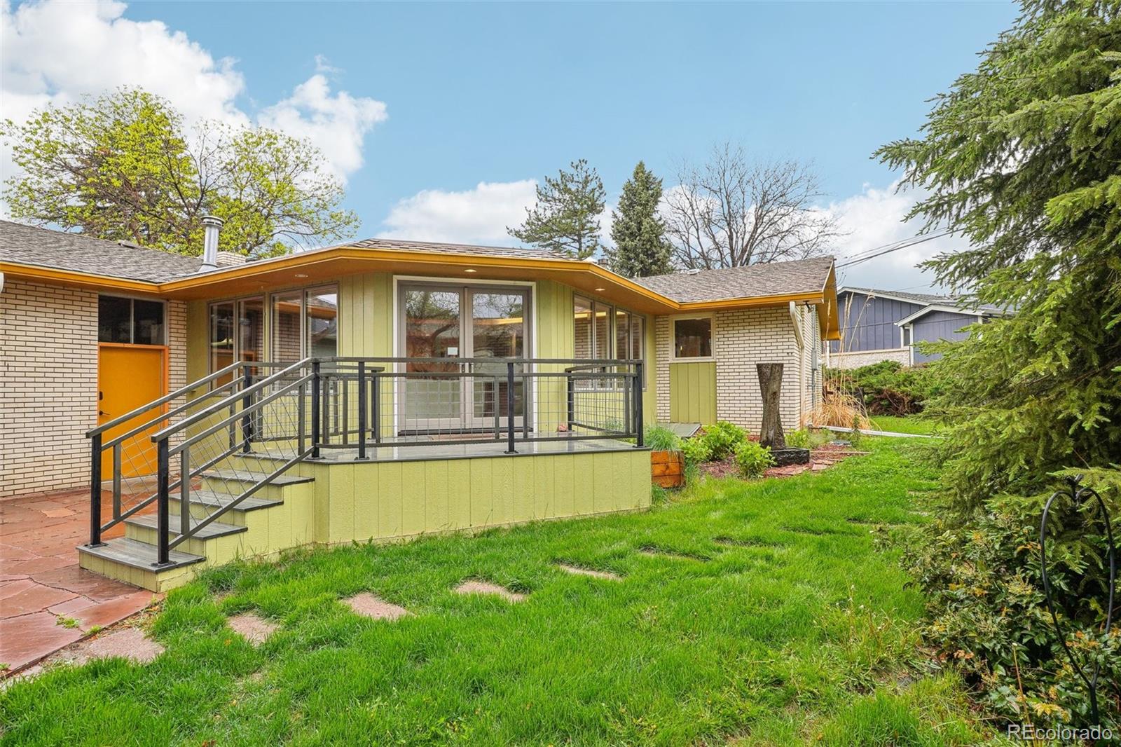1118 Eagle Road Broomfield, CO 80020 - Photo 46 of 50 a view of a house with a swimming pool and a yard
