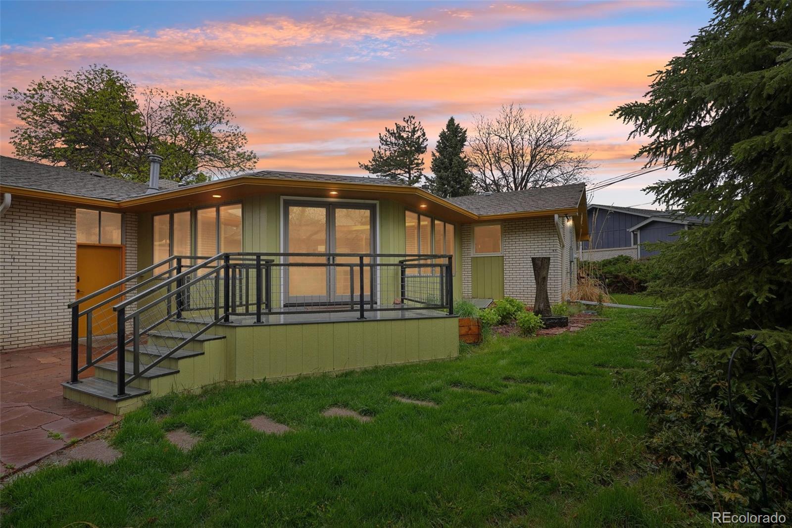 1118 Eagle Road Broomfield, CO 80020 - Photo 49 of 50 a view of a house with a yard and a garden