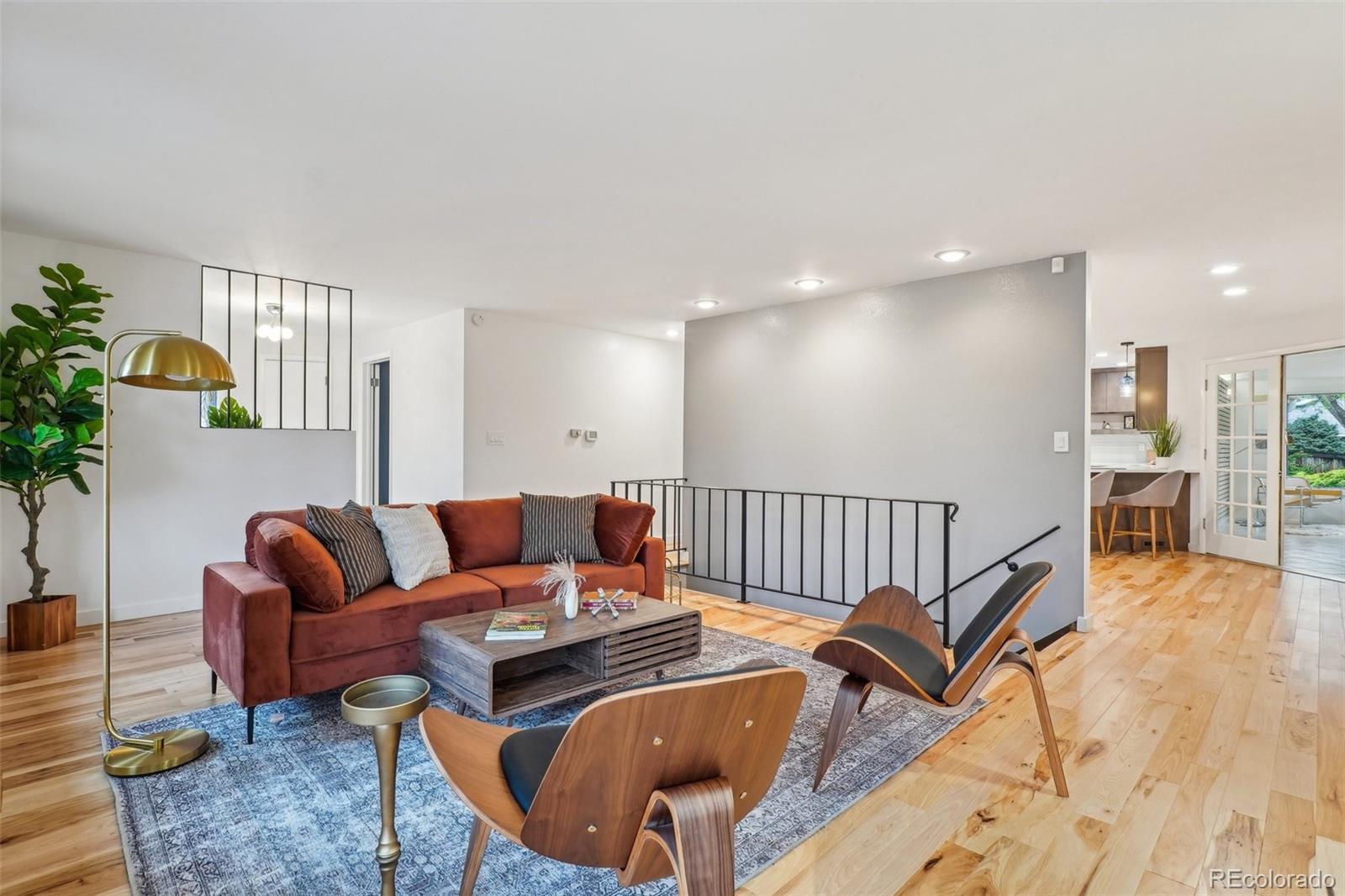 1118 Eagle Road Broomfield, CO 80020 - Photo 7 of 50 a living room with furniture and a wooden floor