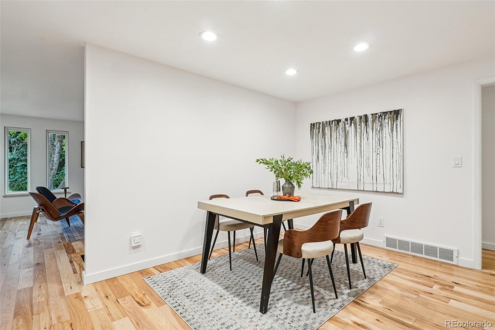 1118 Eagle Road Broomfield, CO 80020 - Photo 9 of 50 a view of a dining room with furniture and wooden floor
