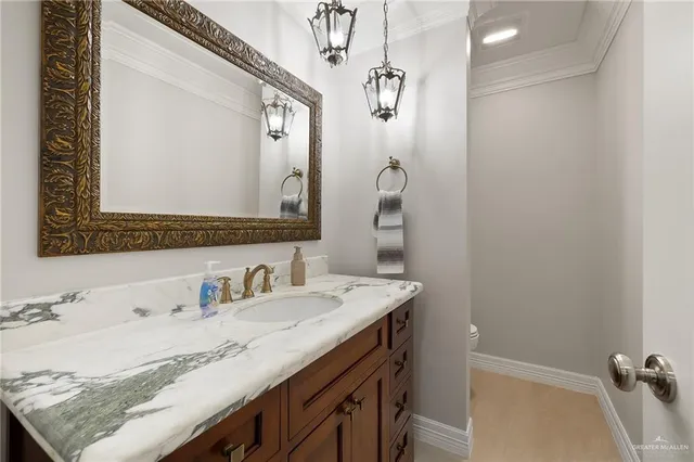 a utility room with cabinets washer and dryer