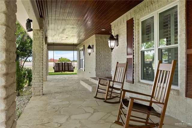 a view of living room kitchen and entryway
