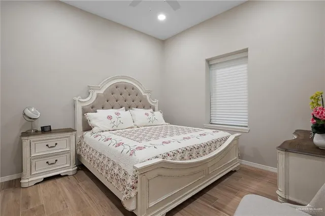 a kitchen with a refrigerator and a stove top oven