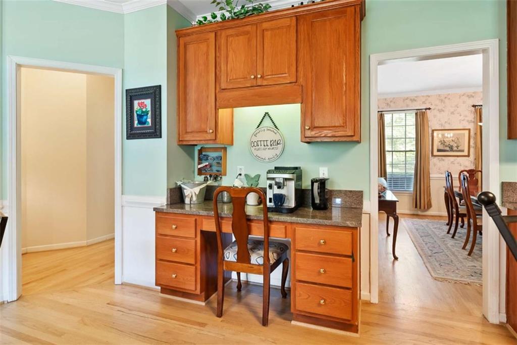 2055 Smyrna Road Southwest Conyers, GA 30094 - Photo 15 of 37 a dining room with wooden floor and windows
