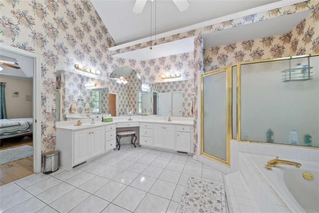 2055 Smyrna Road Southwest Conyers, GA 30094 - Photo 18 of 37 a large white kitchen with a large window