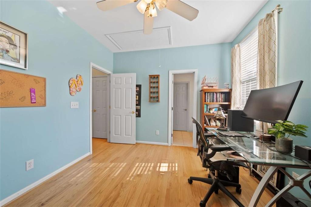 2055 Smyrna Road Southwest Conyers, GA 30094 - Photo 21 of 37 a view of a workspace with furniture and a window