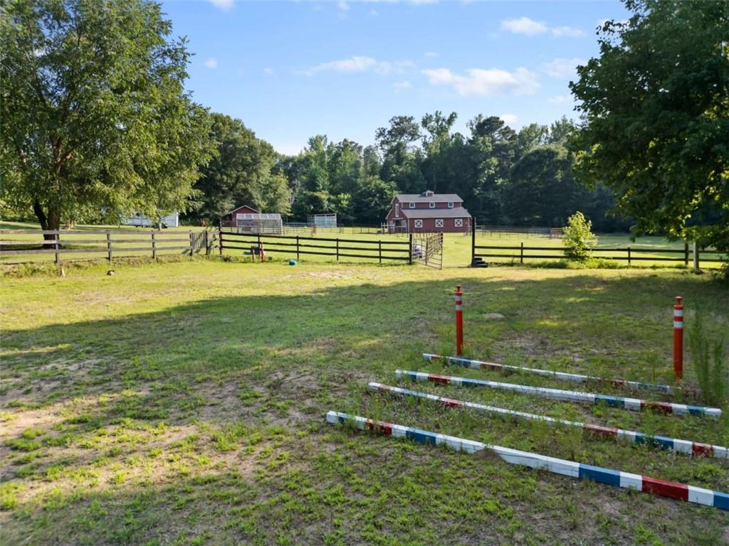 2055 Smyrna Road Southwest Conyers, GA 30094 - Photo 36 of 37 a view of a swimming pool with a yard