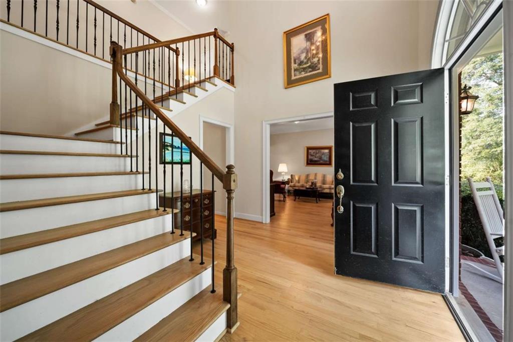 2055 Smyrna Road Southwest Conyers, GA 30094 - Photo 7 of 37 a view of entryway and hall with wooden floor