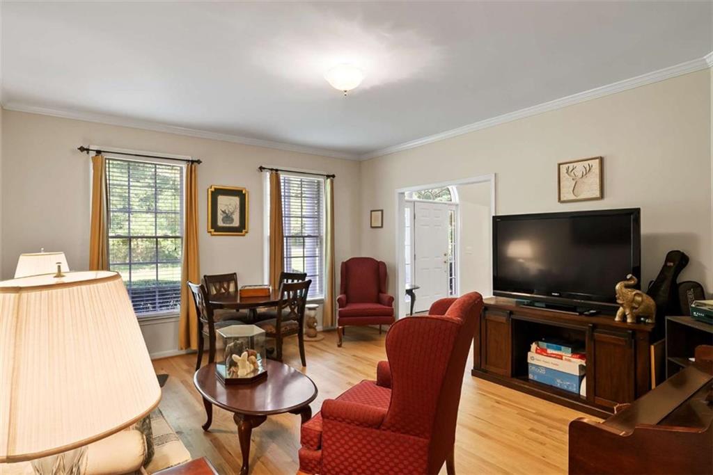 2055 Smyrna Road Southwest Conyers, GA 30094 - Photo 10 of 37 a living room with furniture and a flat screen tv