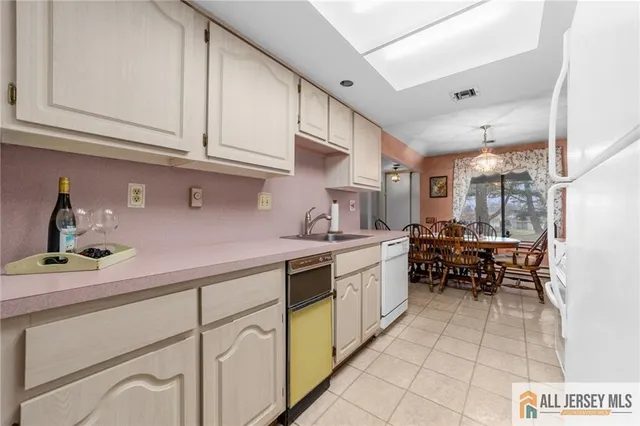 a kitchen with stainless steel appliances granite countertop a sink and cabinets