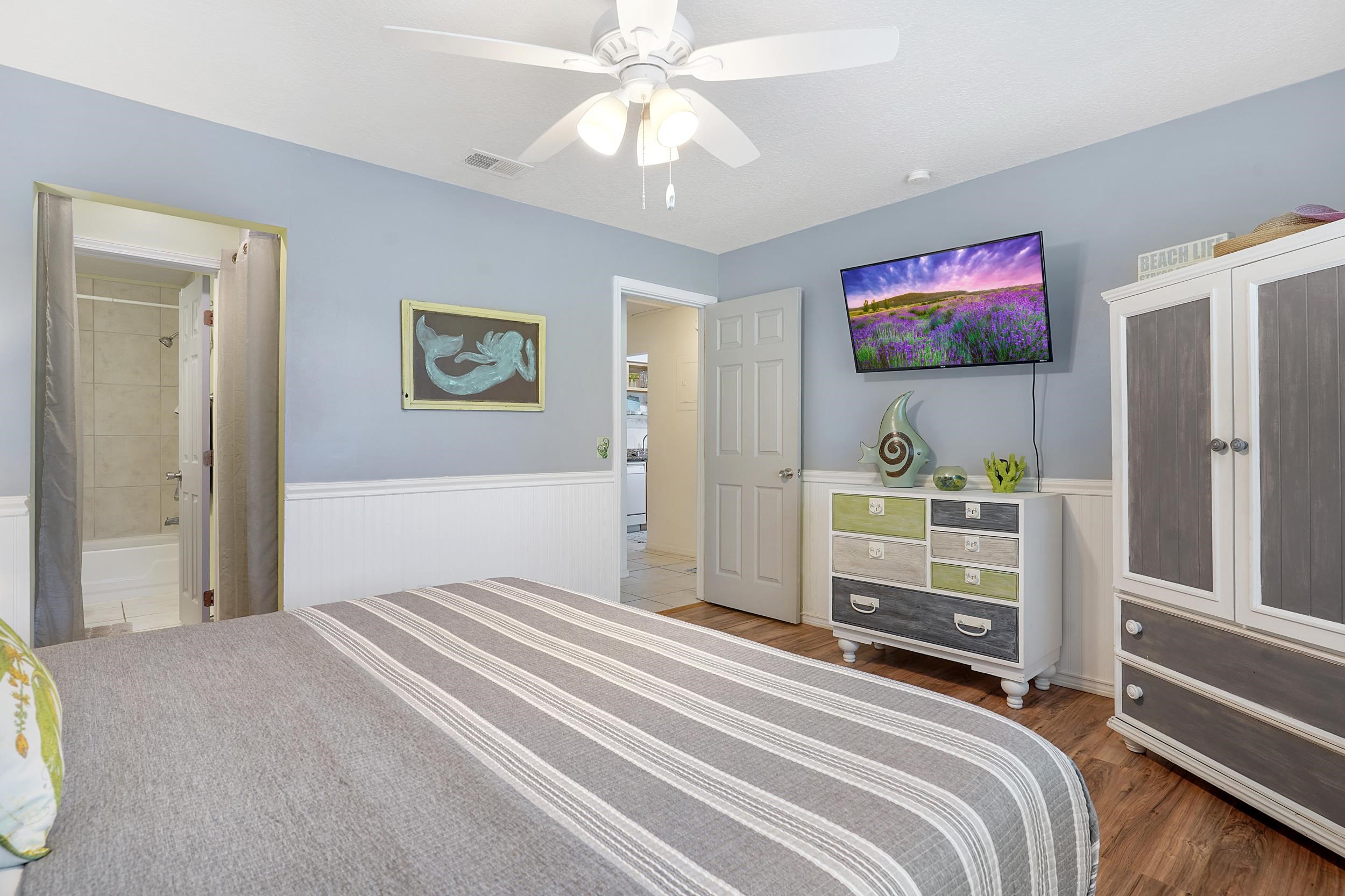 8 Clipper Court St. Augustine Beach, FL 32080 - Photo 13 of 27 a bedroom with a bed and a flat screen tv