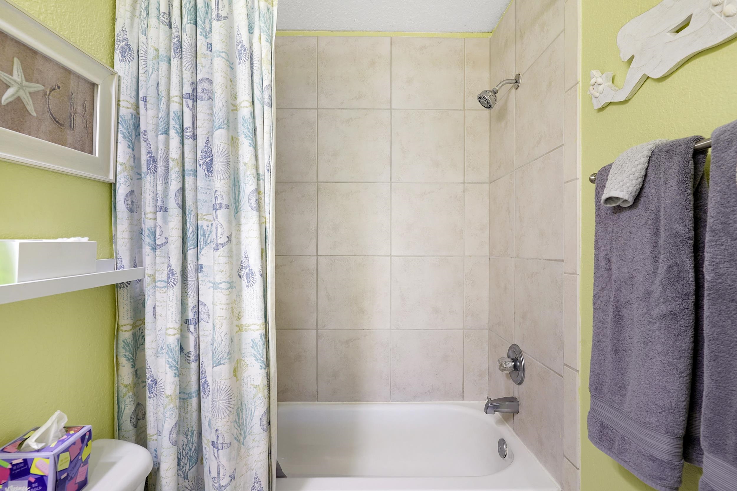8 Clipper Court St. Augustine Beach, FL 32080 - Photo 14 of 27 a bathroom with a shower and a bath tub
