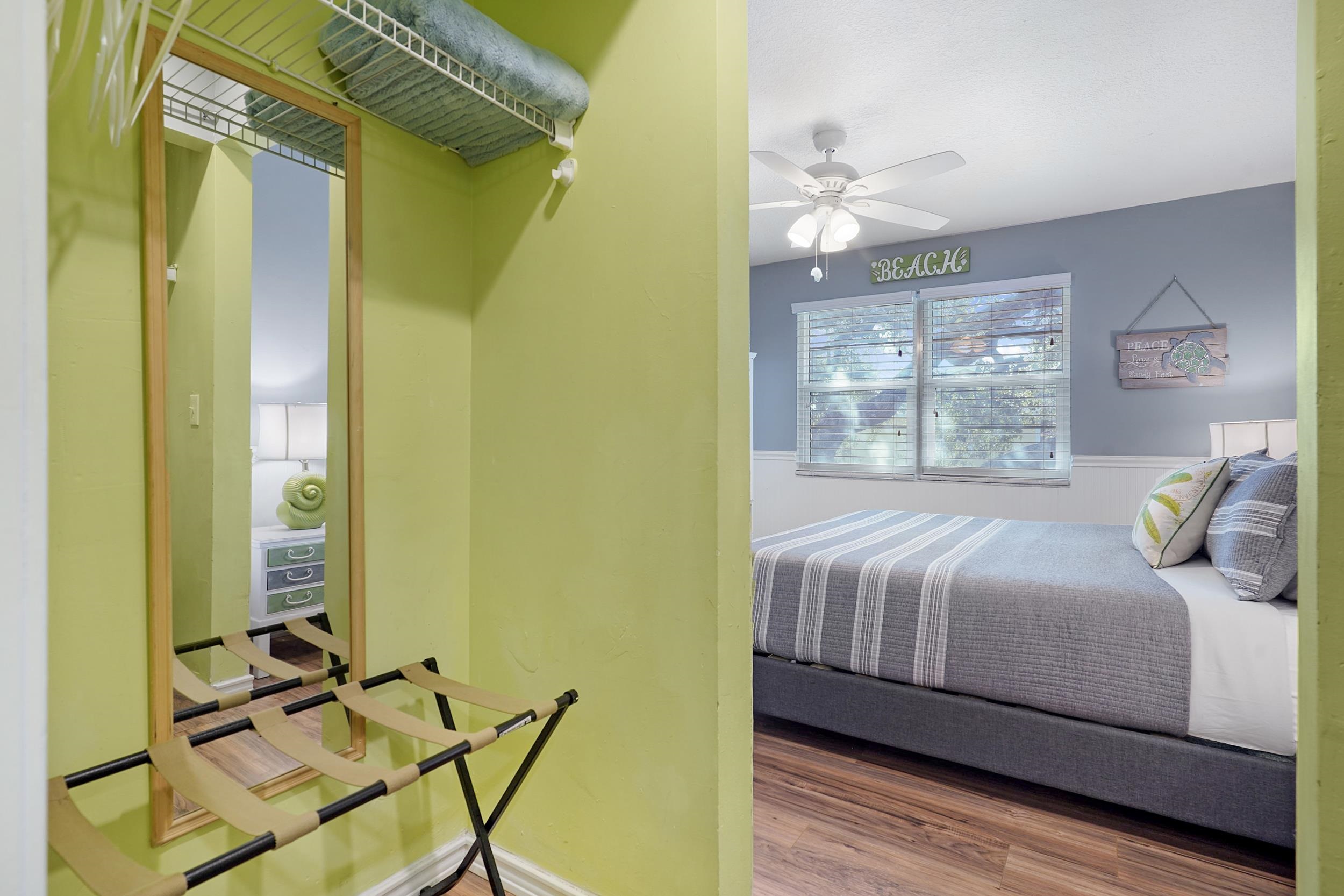 8 Clipper Court St. Augustine Beach, FL 32080 - Photo 16 of 27 a bedroom with a bed window and a chandelier