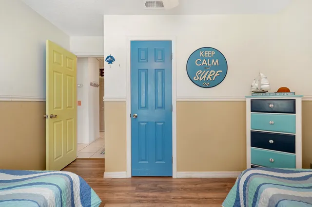 a view of a bedroom with bed and hallway