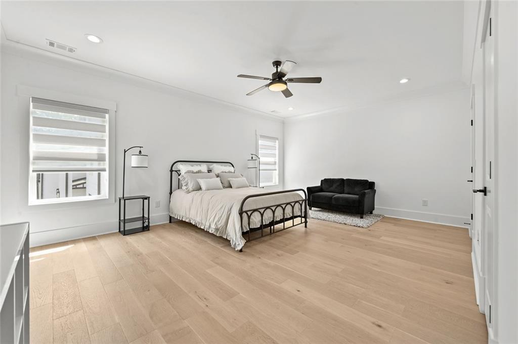 2694 Thompson Mill Road Buford, GA 30519 - Photo 56 of 70 a bedroom with a bed dresser and a window