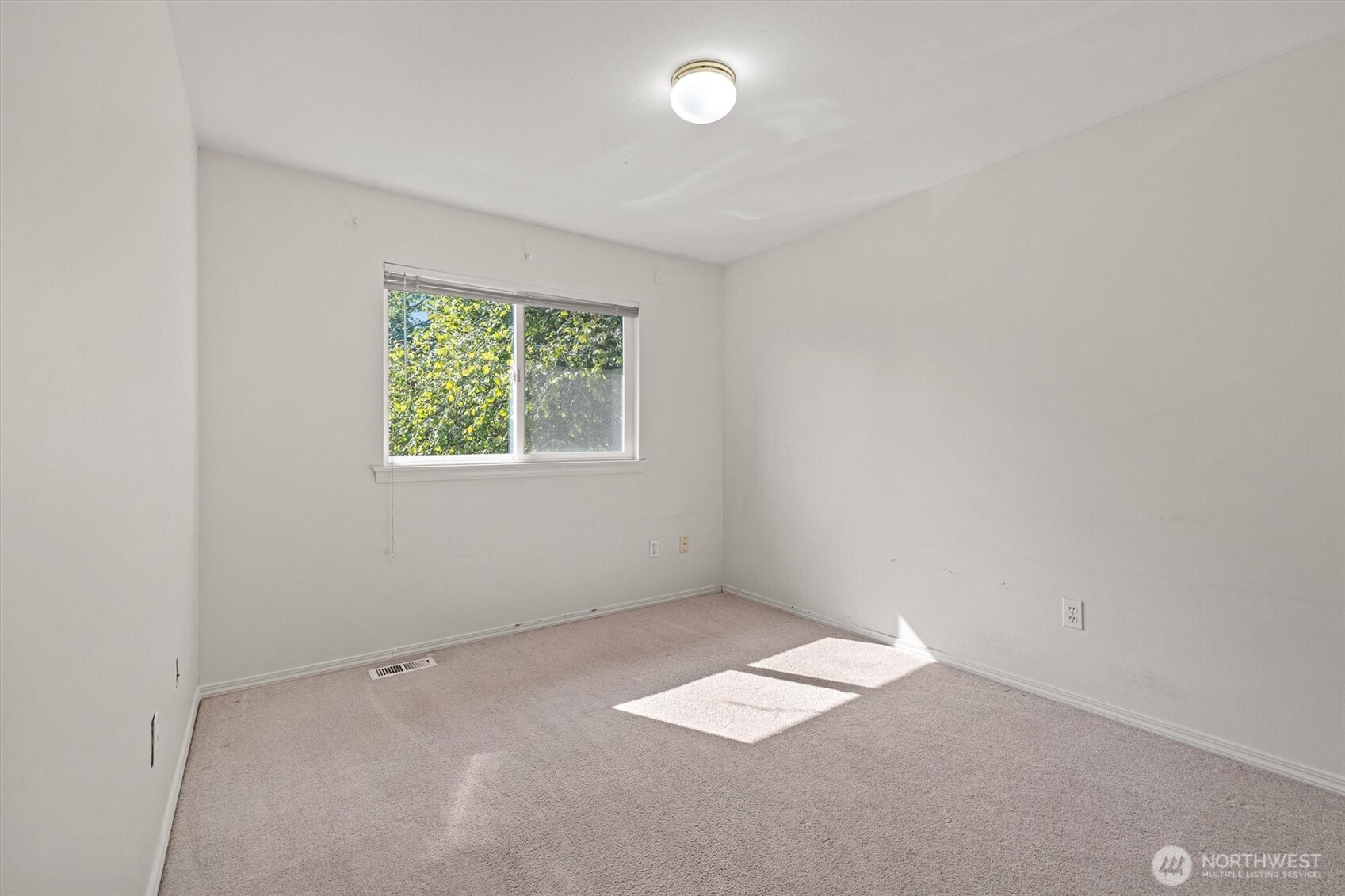 2320 Northeast 102nd Street Seattle, WA 98125 - Photo 11 of 19 an empty room with a window