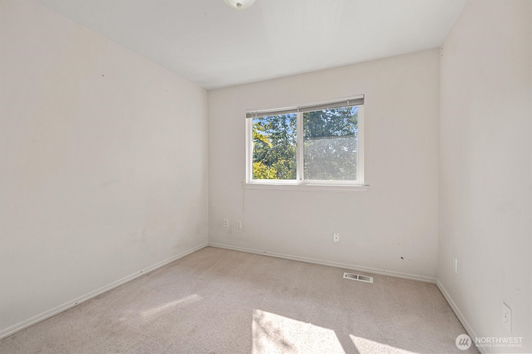 2320 Northeast 102nd Street Seattle, WA 98125 - Photo 12 of 19 an empty room with a window
