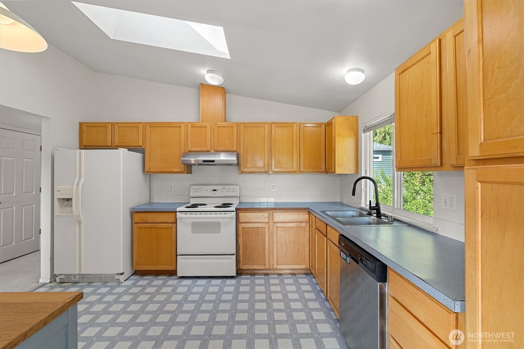 2320 Northeast 102nd Street Seattle, WA 98125 - Photo 7 of 19 a kitchen with a sink appliances and cabinets