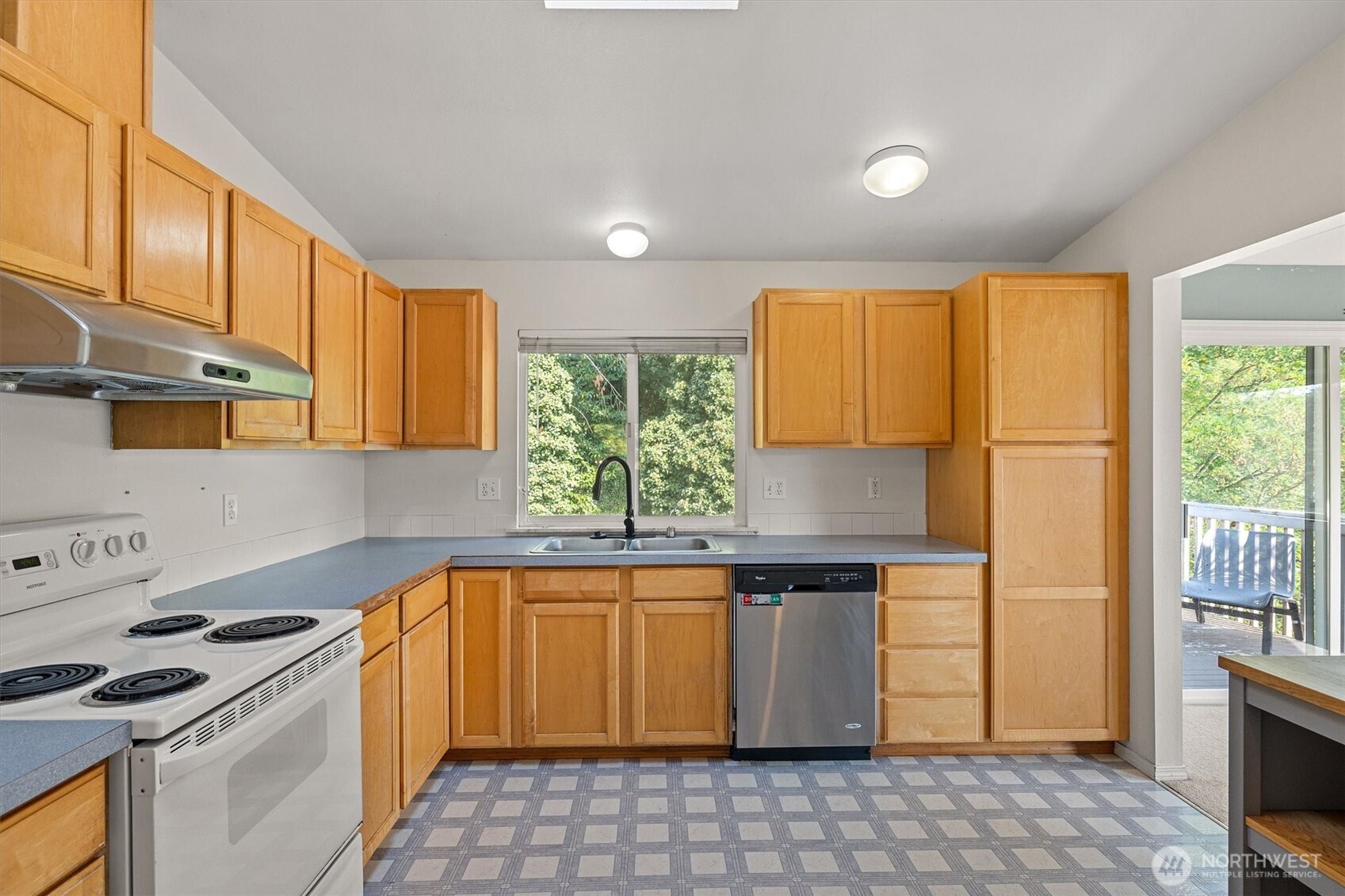 2320 Northeast 102nd Street Seattle, WA 98125 - Photo 8 of 19 a kitchen with stainless steel appliances granite countertop a stove a sink and a microwave
