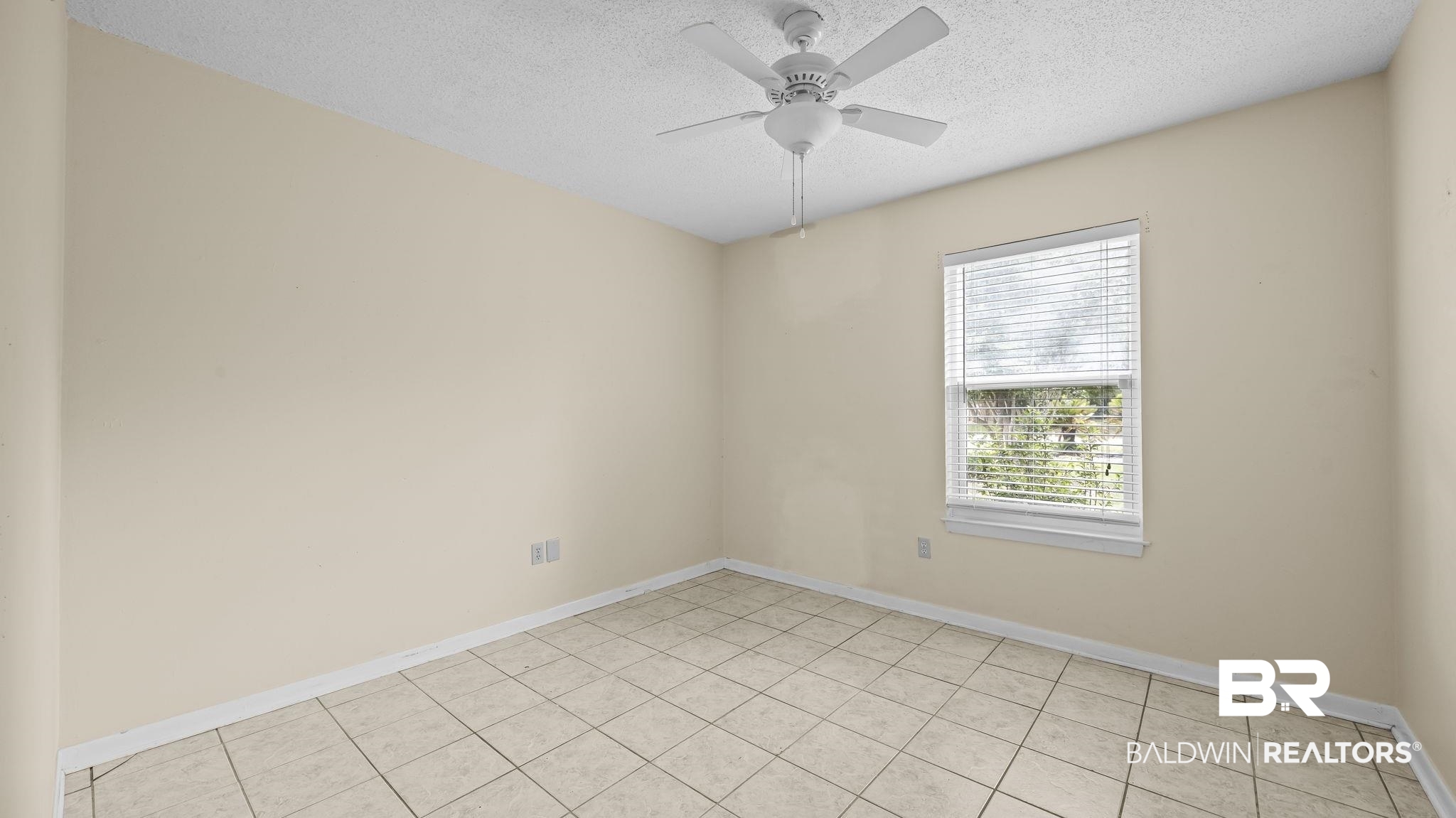 15096 Highland Circle Foley, AL 36535 - Photo 21 of 52 Neutral-toned room featuring a window with horizontal blinds, tiled flooring, and a ceiling fan