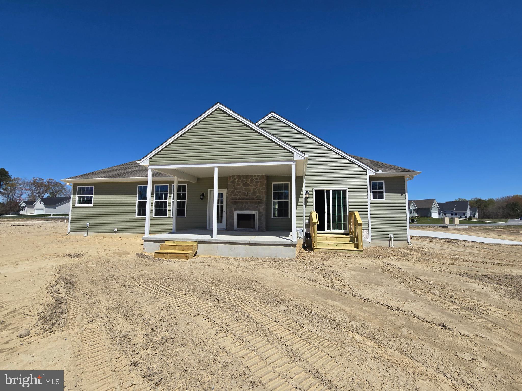 10 Antlered Way Georgetown, DE 19947 - Photo 29 of 29 a front view of a house with a yard and seating space