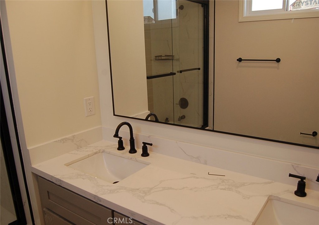 425 West Duarte Road, Unit 411B Monrovia, CA 91016 - Photo 12 of 34 a bathroom with a sink and mirror