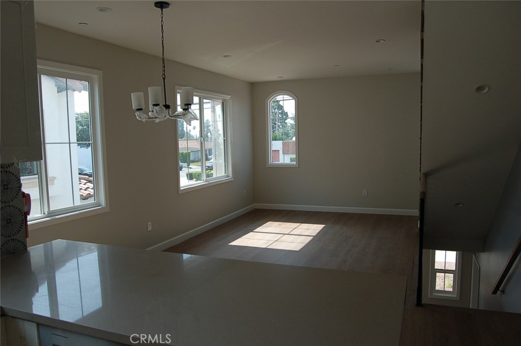 425 West Duarte Road, Unit 411B Monrovia, CA 91016 - Photo 13 of 34 a view of an empty room with window and chandelier fan
