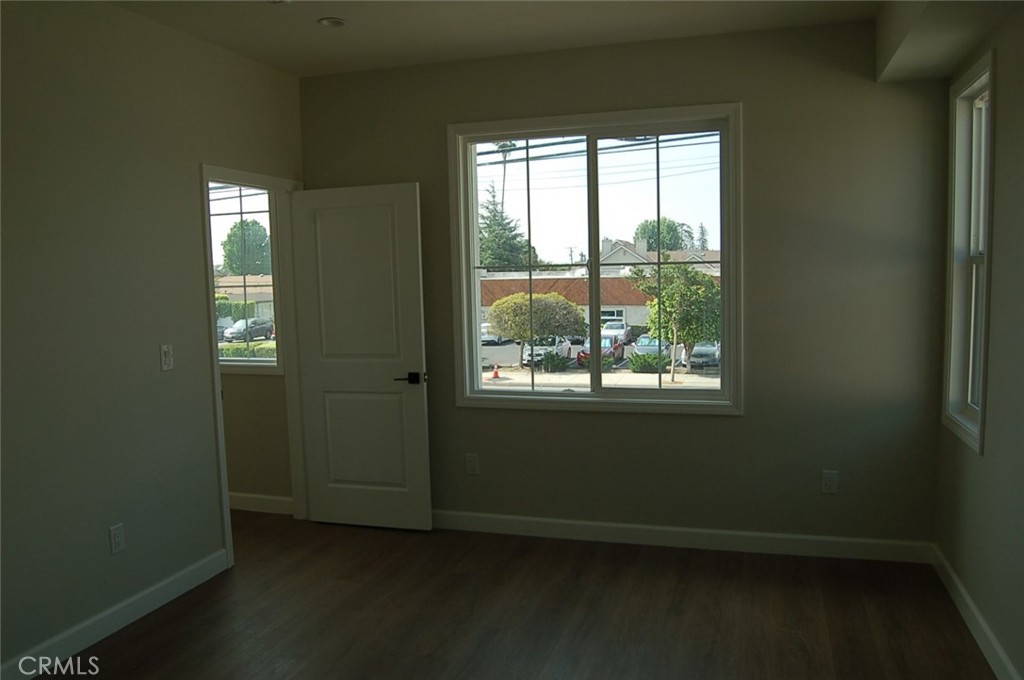 425 West Duarte Road, Unit 411B Monrovia, CA 91016 - Photo 20 of 34 an empty room with wooden floor and windows