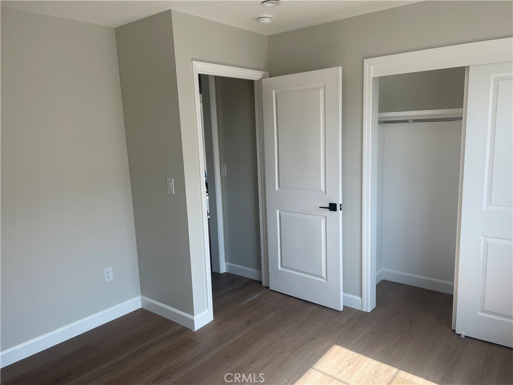 425 West Duarte Road, Unit 411B Monrovia, CA 91016 - Photo 27 of 34 a view of an empty room with wooden floor and closet