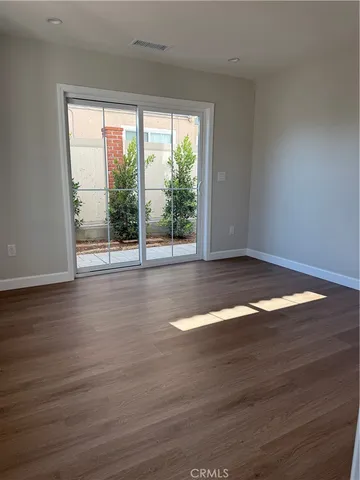 an empty room and wooden door