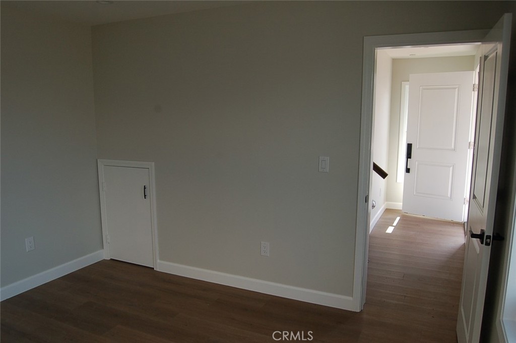 425 West Duarte Road, Unit 411B Monrovia, CA 91016 - Photo 7 of 34 an empty room and wooden door