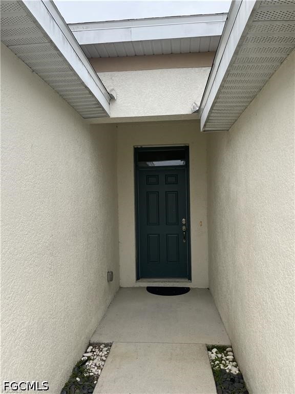 8187 Gopher Tortoise Trail Lehigh Acres, FL 33972 - Photo 5 of 23 a view of a livingroom with a staircase