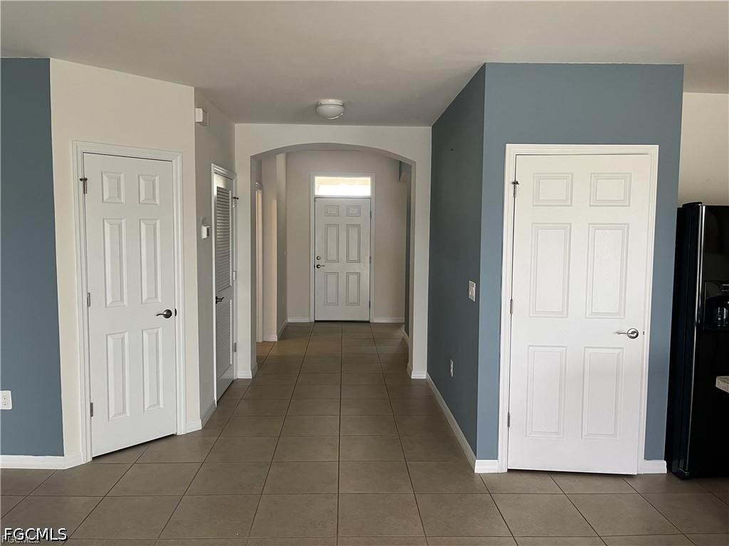 8187 Gopher Tortoise Trail Lehigh Acres, FL 33972 - Photo 6 of 23 a view of a hallway with some storage area