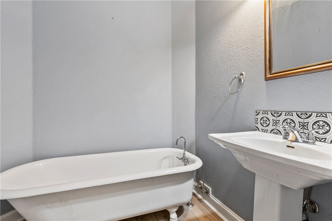 6701 Old Reliance Road Bryan, TX 77808 - Photo 22 of 44 a bathroom with a sink a toilet and mirror