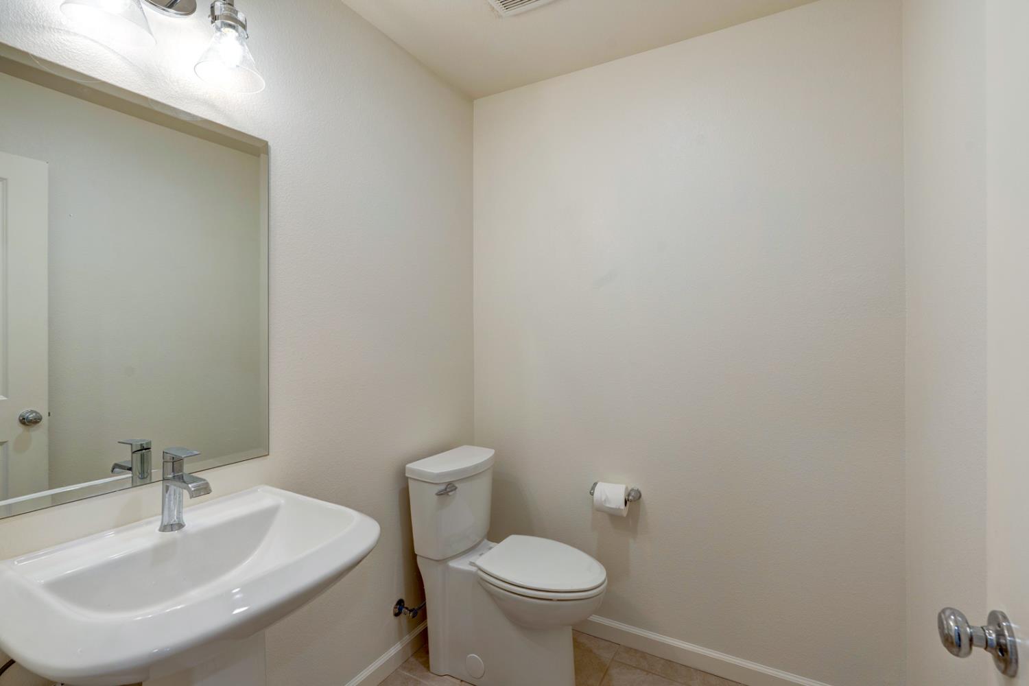 753 Heitz Way Merced, CA 95348 - Photo 21 of 70 a bathroom with a sink and a toilet