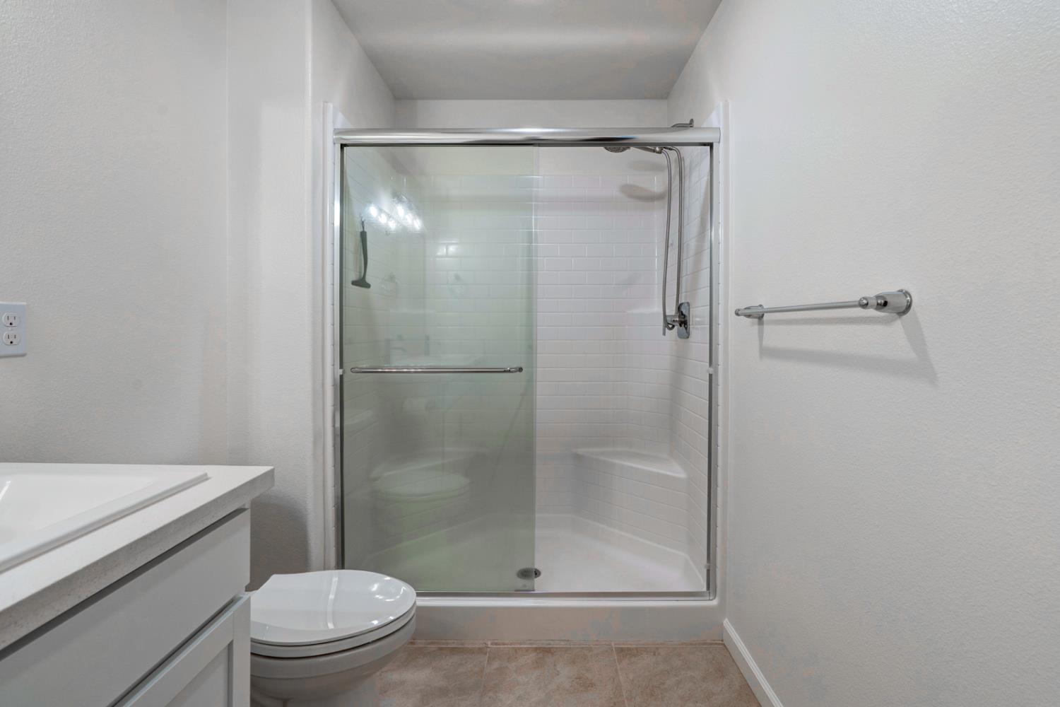 753 Heitz Way Merced, CA 95348 - Photo 42 of 70 a bathroom with a shower a toilet and sink