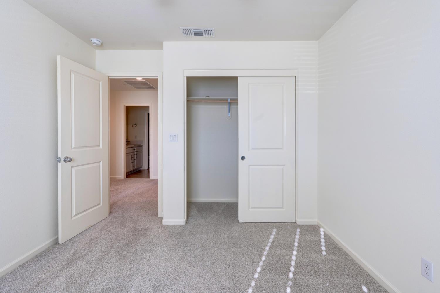 753 Heitz Way Merced, CA 95348 - Photo 51 of 70 a view of a hallway with closet and a bathroom