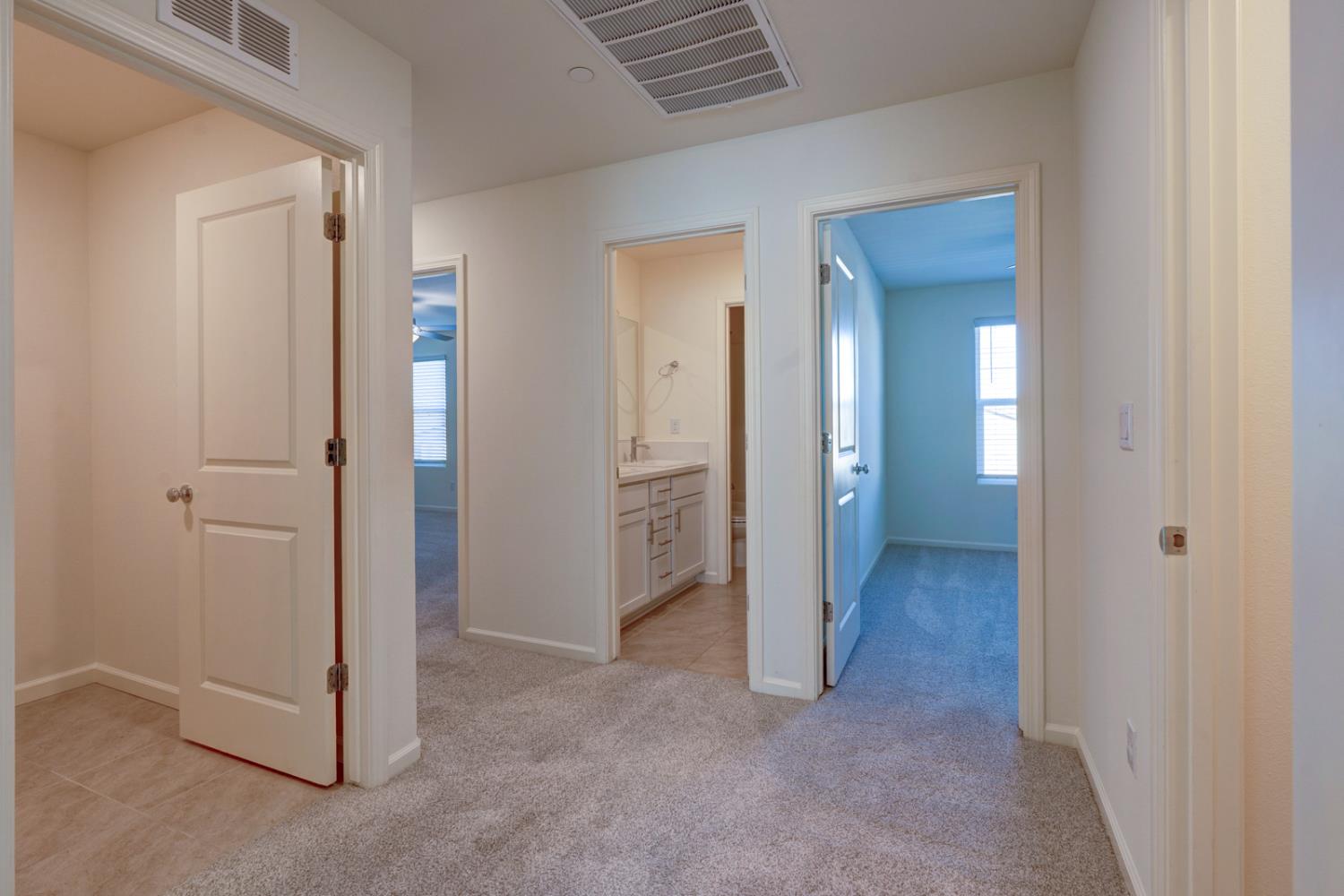 753 Heitz Way Merced, CA 95348 - Photo 54 of 70 an empty room with closet and mirror