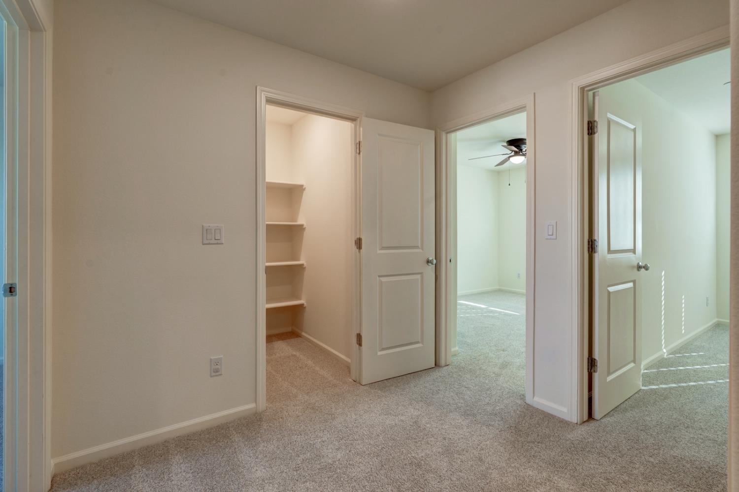 753 Heitz Way Merced, CA 95348 - Photo 55 of 70 an empty room with closet and mirrors