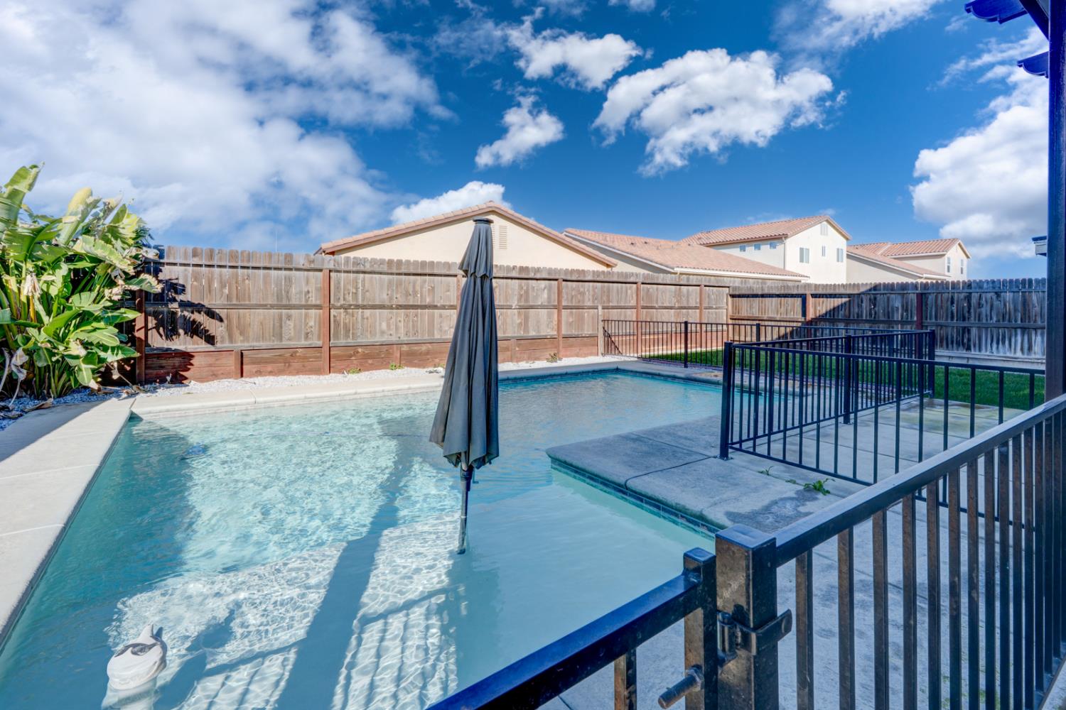 753 Heitz Way Merced, CA 95348 - Photo 57 of 70 a view of a balcony with a potted plants