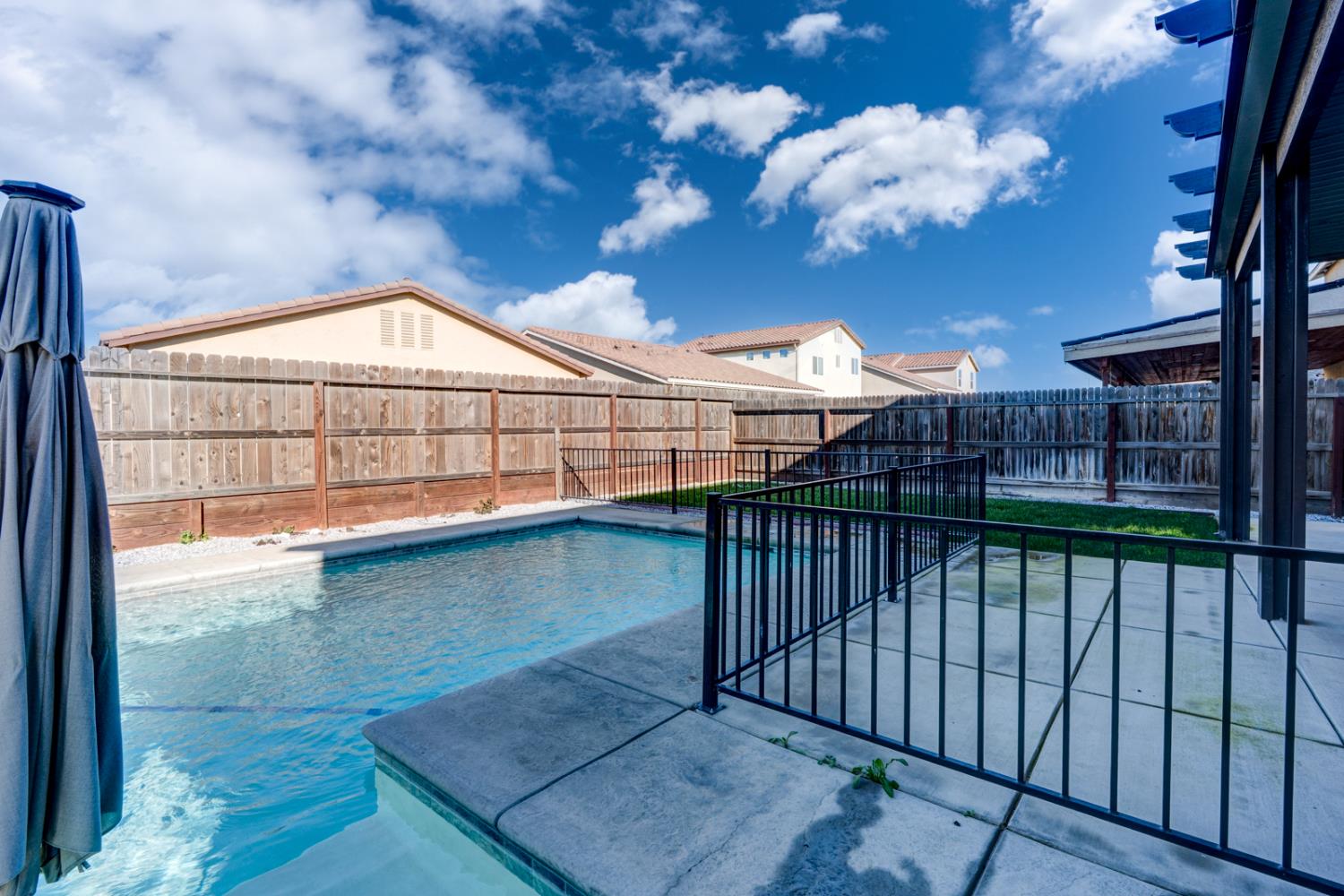753 Heitz Way Merced, CA 95348 - Photo 61 of 70 a view of a balcony with a potted plant