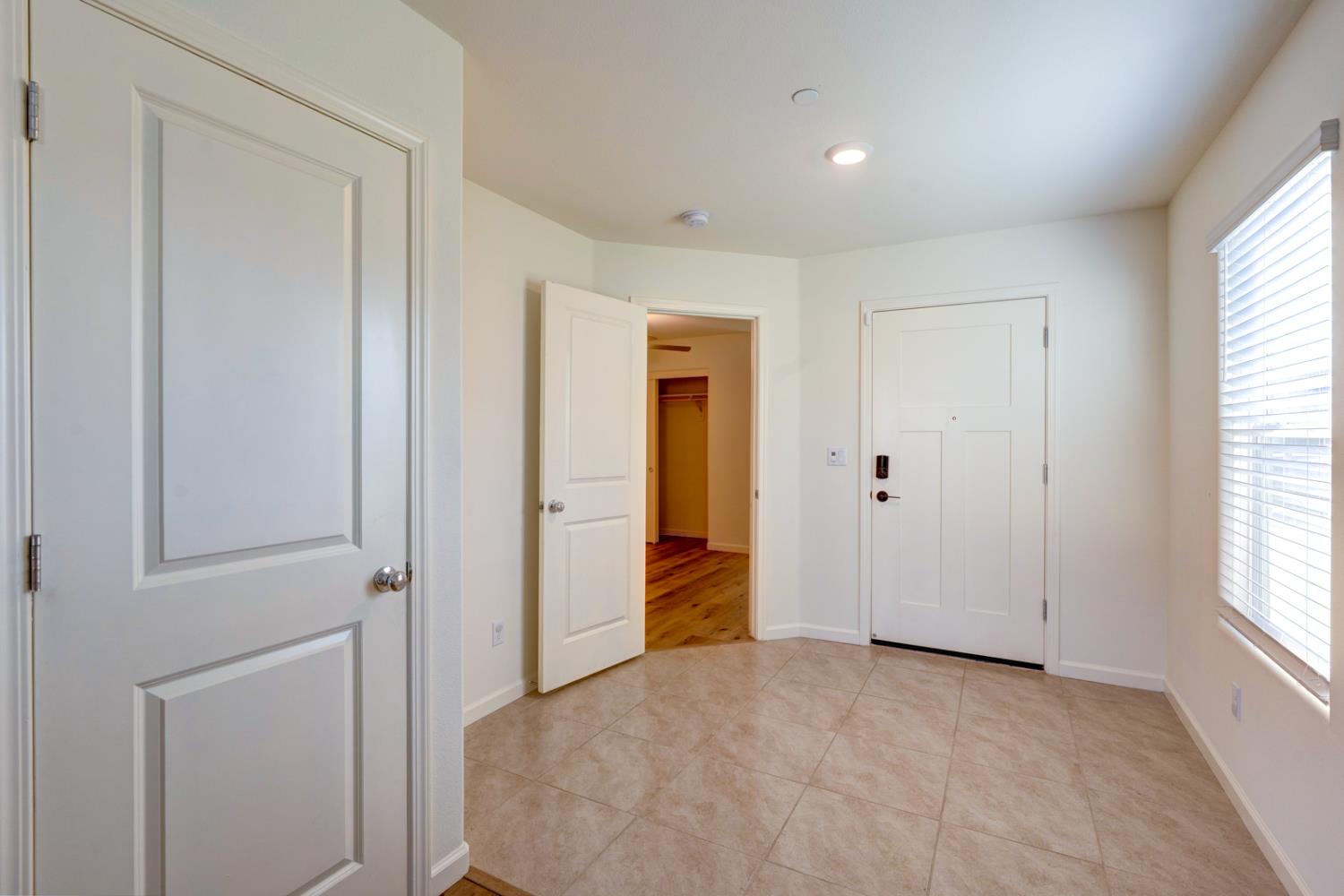 753 Heitz Way Merced, CA 95348 - Photo 8 of 70 an empty room with windows and closet