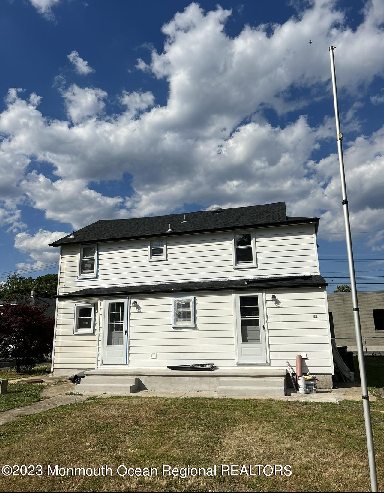 8a Washington Avenue, Unit B Matawan, NJ 07747 - Photo 16 of 16 a front view of a house with a yard