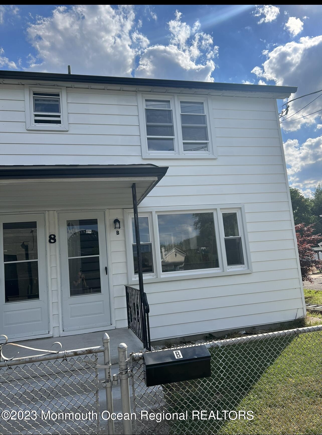 8a Washington Avenue, Unit B Matawan, NJ 07747 - Photo 2 of 16 a view of a house with a small backyard