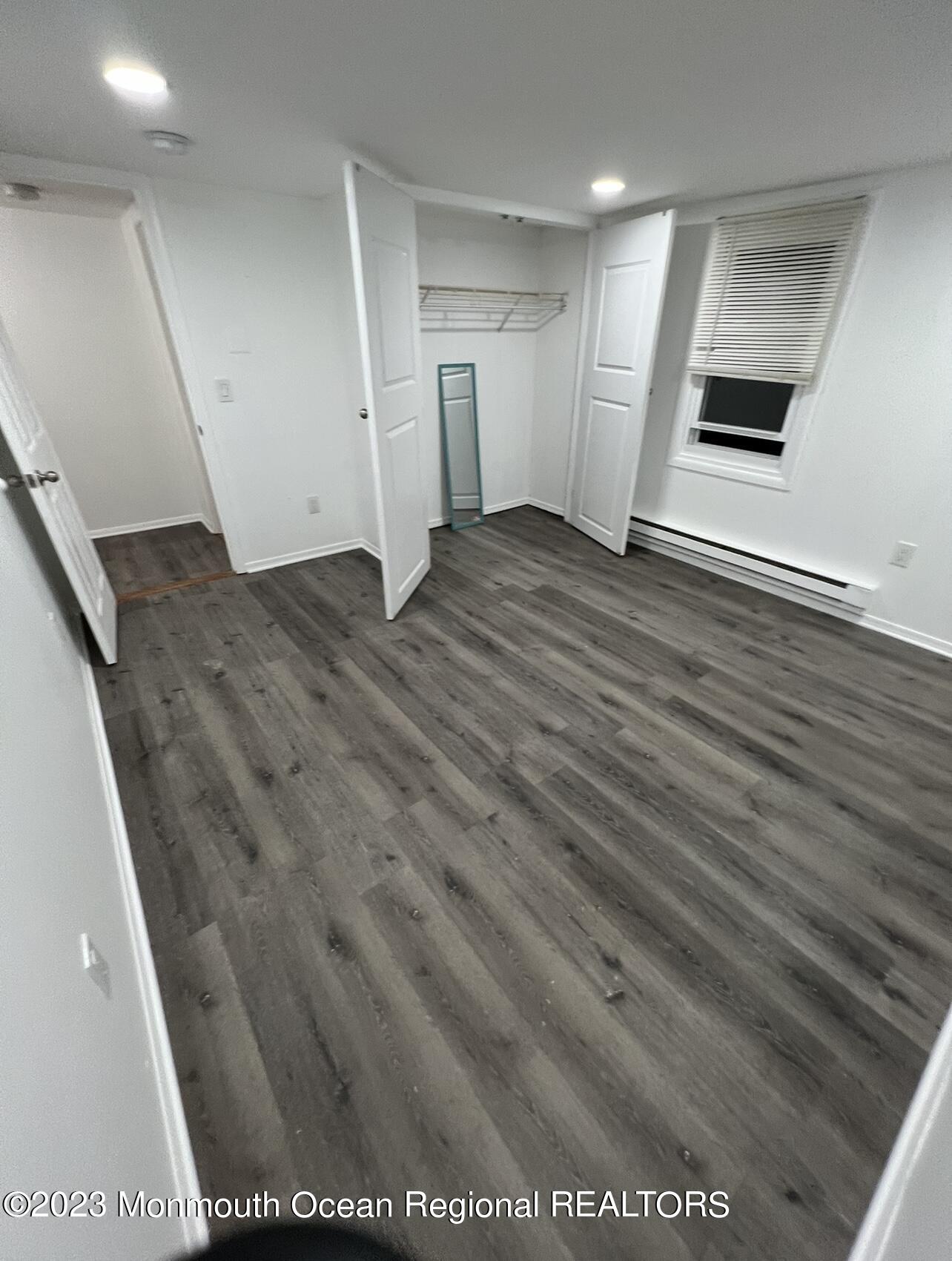 8a Washington Avenue, Unit B Matawan, NJ 07747 - Photo 6 of 16 a view of empty room with wooden floor