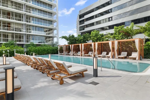 a view of a patio with a table and chairs