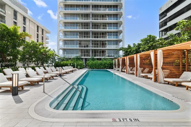a view of swimming pool with outdoor seating