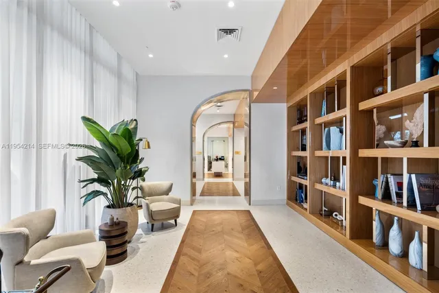 a living room with furniture and a potted plant