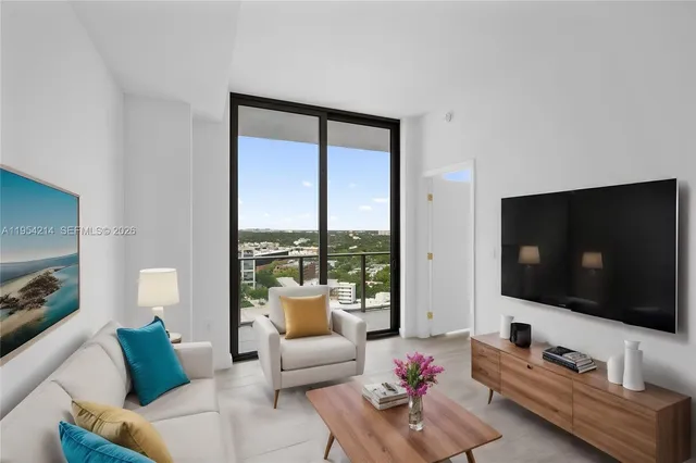 a living room with furniture and a flat screen tv